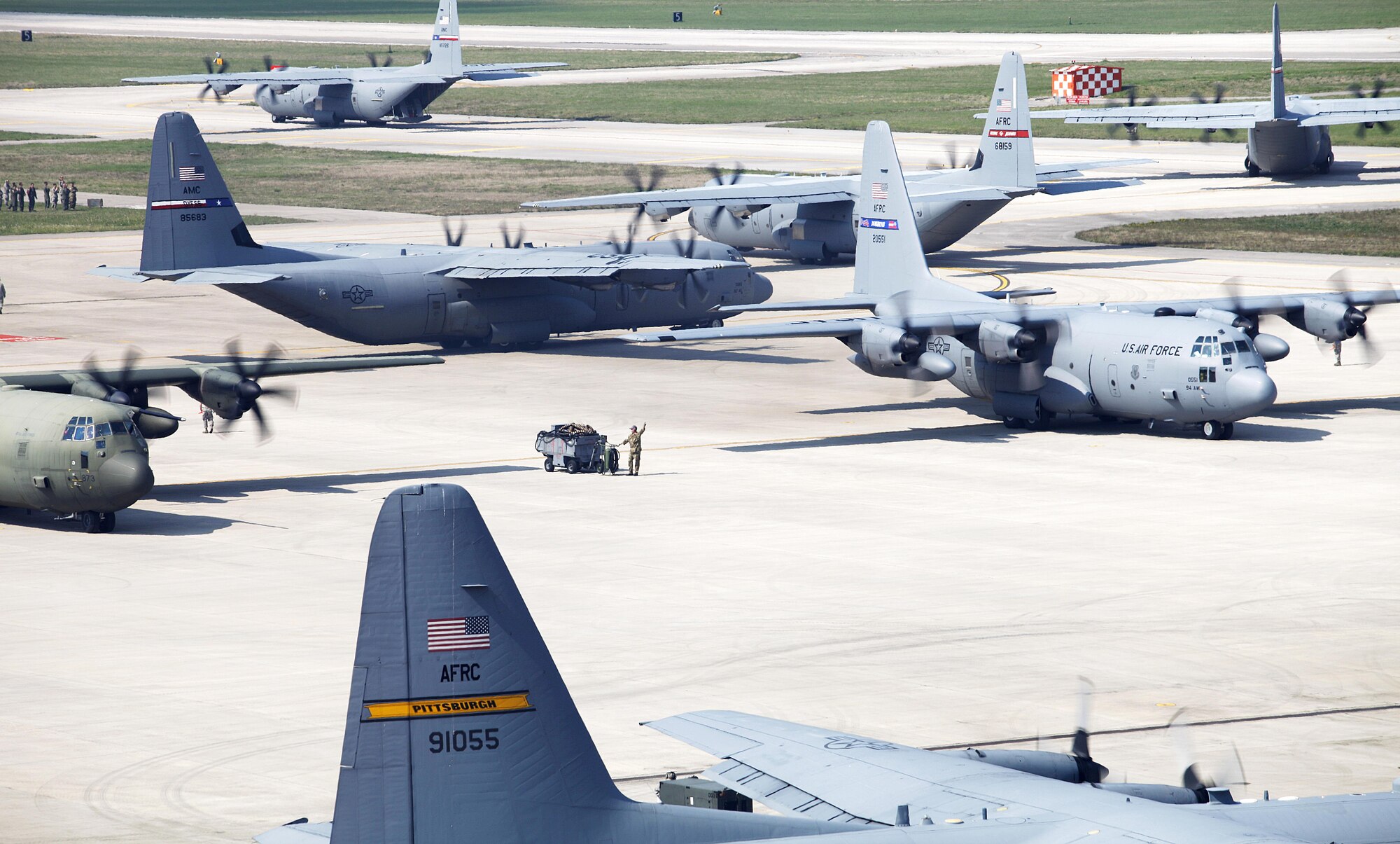 An 815th Airlift Squadron C-130J Super Hercules and other C-130s filled with soldiers from the U.S. Army 173rd Airborne Brigade line up at Aviano Air Base, Italy, to depart for Saber Junction 16, April 12, 2016. Paratroopers from the 173rd Airborne Brigade were off to Hohenfels, Germany for a combined operation with participating Allied and partner nations. (U.S. Army photo/Katie Currid)