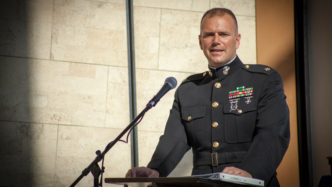 Maj. Christopher Cotton, inspector-instructor, Battery M, 3rd Battalion, 14th Marine Regiment, Marine Forces Reserve speaks during a Purple Heart ceremony held in honor of Gunnery Sgt. Thomas J. Sullivan, Staff Sgt. David Wyatt, Sgt. Carson Holmquist, and Lance Cpl. Squire Wells at the Hunter Museum of American Art in Chattanooga, Tenn., April 20, 2016. The Marines were honored for giving their lives to protect others when they were attacked by a gunman at the Naval Operational Support Center and Marine Corps Reserve Center in Chattanooga on July 16, 2015.