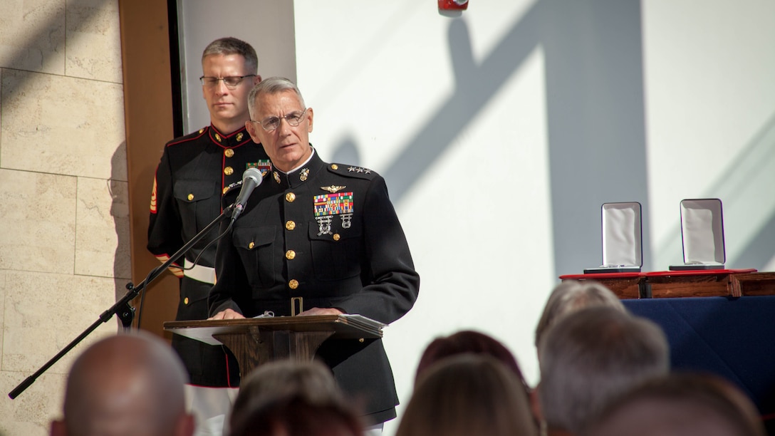 Lt. Gen. Rex C. McMillian, commander of Marine Forces Reserve presents the Purple Heart to the families of Gunnery Sgt. Thomas J. Sullivan, Staff Sgt. David Wyatt, Sgt. Carson Holmquist, and Lance Cpl. Squire Wells at the Hunter Museum of American Art in Chattanooga, Tenn., April 20, 2016. The Marines were honored for giving their lives to protect others when they were attacked by a gunman at the Naval Operational Support Center and Marine Corps Reserve Center in Chattanooga on July 16, 2015.