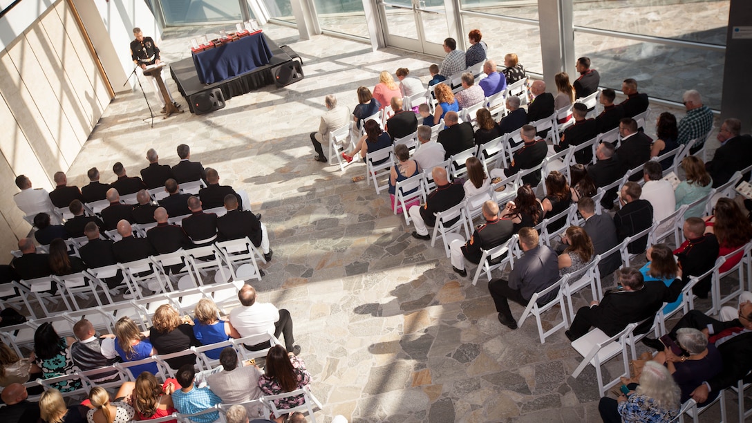Marines, family and friends attend a Purple Heart ceremony in honor of Gunnery Sgt. Thomas J. Sullivan, Staff Sgt. David Wyatt, Sgt. Carson Holmquist, and Lance Cpl. Squire Wells at the Hunter Museum of American Art in Chattanooga, Tenn., April 20, 2016. The Marines were honored for giving their lives to protect others when they were attacked by a gunman at the Naval Operational Support Center and Marine Corps Reserve Center in Chattanooga on July 16, 2015. 