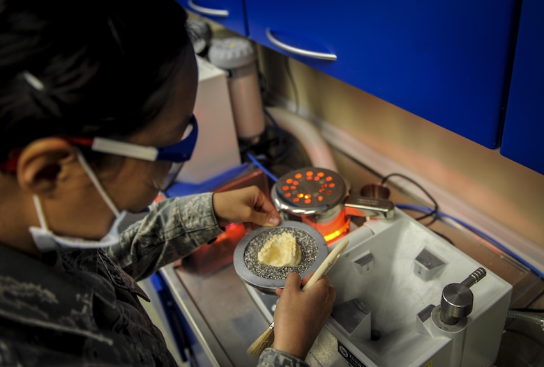 Airman 1st Class Christine Chang, a dental laboratory technician with the 1st Special Operations Dental Squadron, prepares to make a mouth guard at Hurlburt Field, Fla., April 18, 2016. This four-manned laboratory cares for more than 40 patients every month. (U.S. Air Force photo by Senior Airman Meagan Schutter)