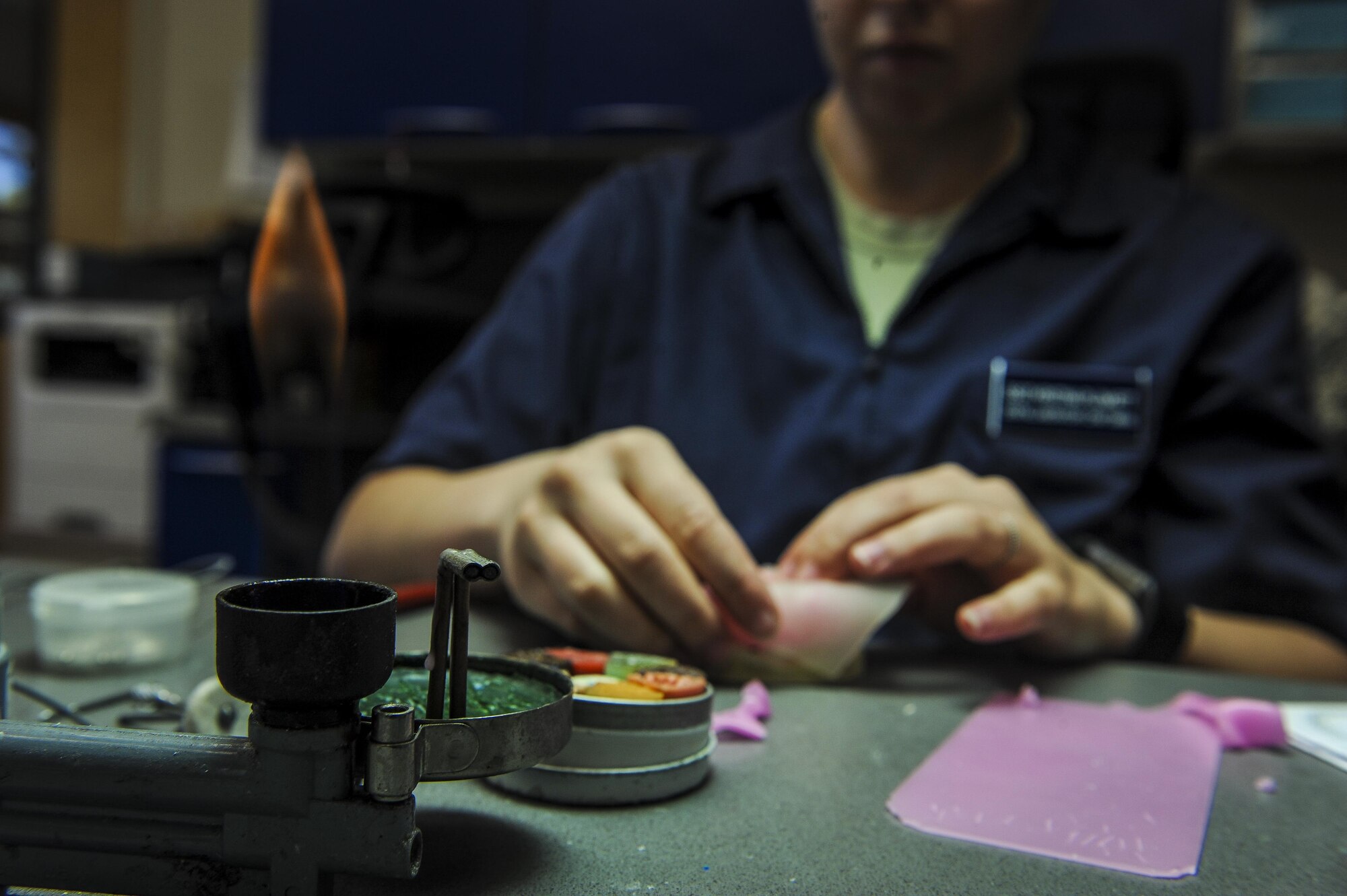 Staff Sgt. Kristina Plunkett, a dental laboratory technician with the 1st Special Operations Dental Squadron, shapes wax to a custom tray at Hurlburt Field, Fla., April 18, 2016. This four-manned laboratory cares for more than 40 patients every month. (U.S. Air Force photo by Senior Airman Meagan Schutter)
