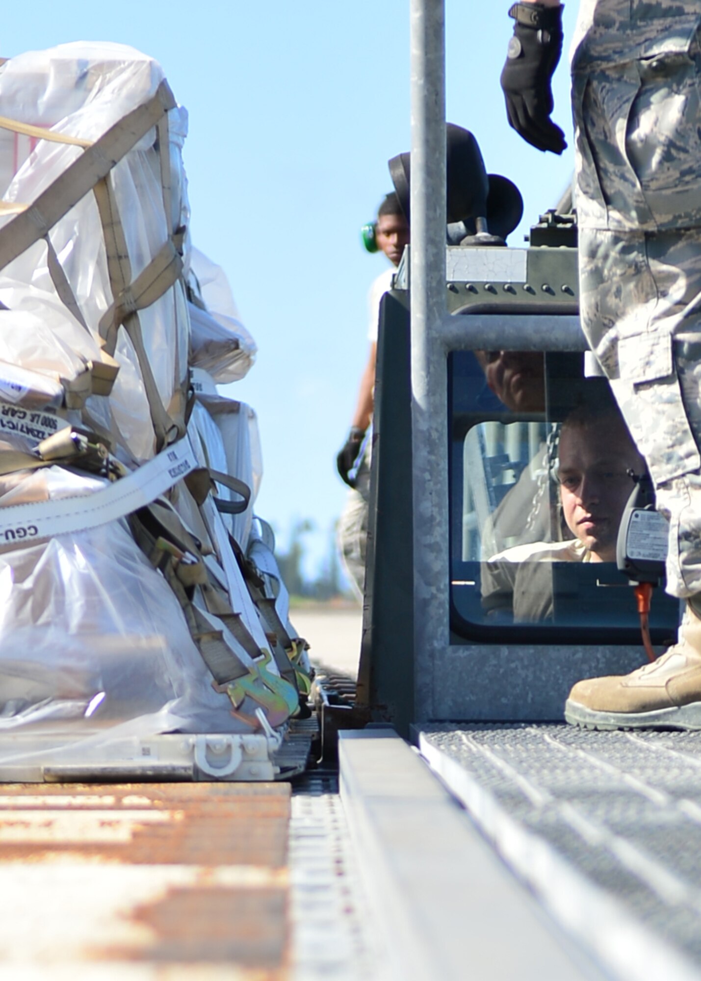 Senior Airman Matthew Worry, an Air Force Reservist from the 32nd Aerial Port Squadron, Pittsburgh Air Reserve Station, operates a Tunner Loader on Joint Base Pearl Harbor-Hickam, April 14, 2016. Approximately 30 Airmen from the 32nd APS traveled to JBPHH to conduct annual training hosted by the Airmen of the 735th Air Mobility Squadron. (U.S. Air Force photo by Tech. Sgt. Aaron Oelrich)