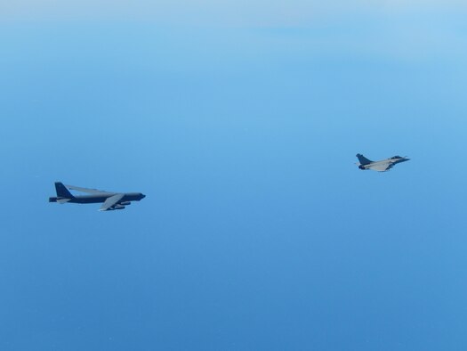 A U.S. Air Force B-52 Stratofortress strategic bomber from Minot Air Force Base, N.D., and a French air force Rafale fighter jet fly over France, April 20, 2016. The B-52 also conducted a flight over the Lafayette Escadrille Memorial in Marnes-la-Coquette, France, during a ceremony honoring the 268 Americans who joined the French air force before the U.S. officially entered World War I. (Courtesy photo)