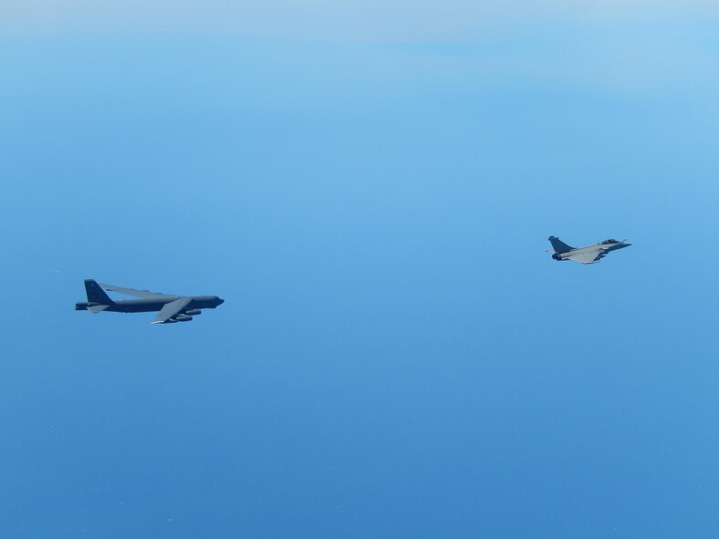 A U.S. Air Force B-52 Stratofortress strategic bomber from Minot Air Force Base, N.D., and a French air force Rafale fighter jet fly over France, April 20, 2016. The B-52 also conducted a flight over the Lafayette Escadrille Memorial in Marnes-la-Coquette, France, during a ceremony honoring the 268 Americans who joined the French air force before the U.S. officially entered World War I. (Courtesy photo)