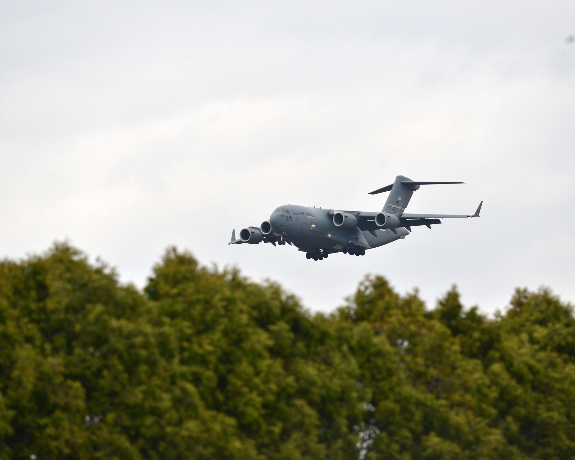 A 445th Airlift Wing C-17 Globemaster III flies a local mission across the Fairborn, Ohio area during a cloudy spring day. (U.S. Air Force photo/Tech. Sgt. Frank Oliver)