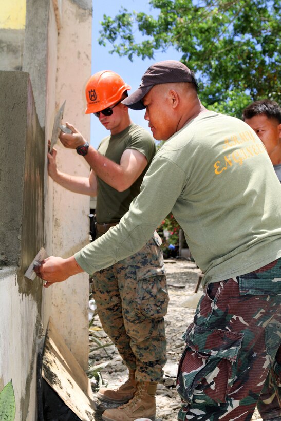 U.S. and Philippine service members finish masonry work at Matangharon Elementary School, Barangay Matangharon, Philippines, as part of Exercise Balikatan, April 3, 2016. Army photo by Staff Sgt. Chanelcherie K. DeMello