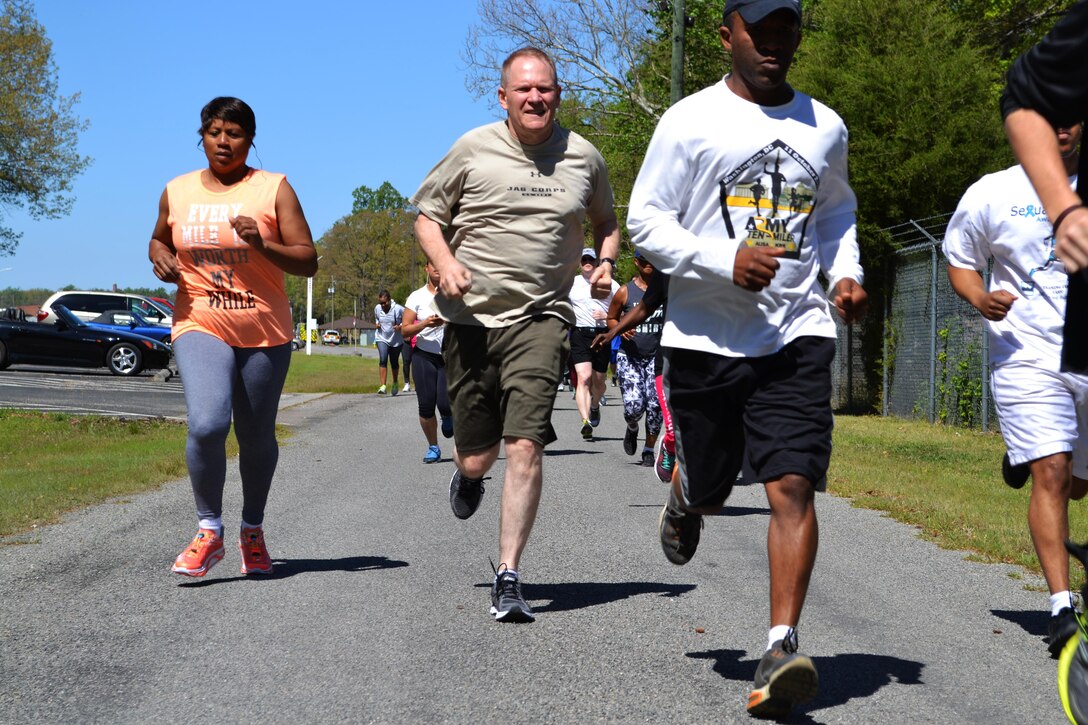 Approximately 50 Soldiers and civilians from five different units participate in the 80th Training Command Sexual Harassment Assault and Response Prevention 5k run and walk event at the Defense Logistics Agency Compound in Richmond, Va., April 20, 2016. The unit conducted the event in observance of Sexual Assault Awareness Month.