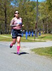 Capt. Gina Thomas, 1st Battalion 311th Regiment Combat Service Support, participates in the 80th Training Command Sexual Harassment/Assault Response and Prevention Program 5K Run/Walk event designed to increase sexual assault and harassment awareness. The event took place at the Defense Supply Center, Richmond, Va., April 20, 2016.