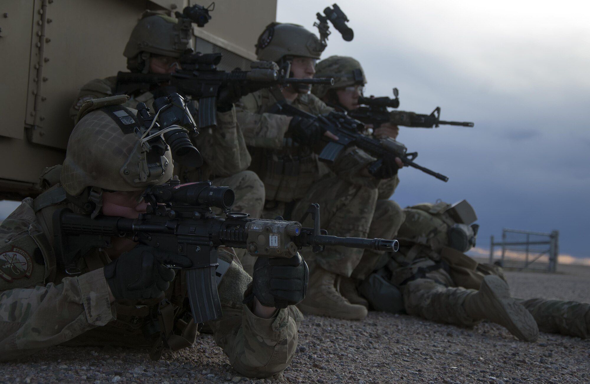 Defenders from the 790th Missile Security Forces Squadron Tactical Response Force take up defensive positions April 14, 2016, as they prepare to advance towards a launch facility during an exercise in the F.E. Warren Air Force Base, Wyo., Missile Complex. Constant Vigilance is an annual Air Force Global Strike Command exercise designed to train and assess the command’s ability to support its conventional and nuclear missions. (U.S. Air Force photo by Senior Airman Brandon Valle)