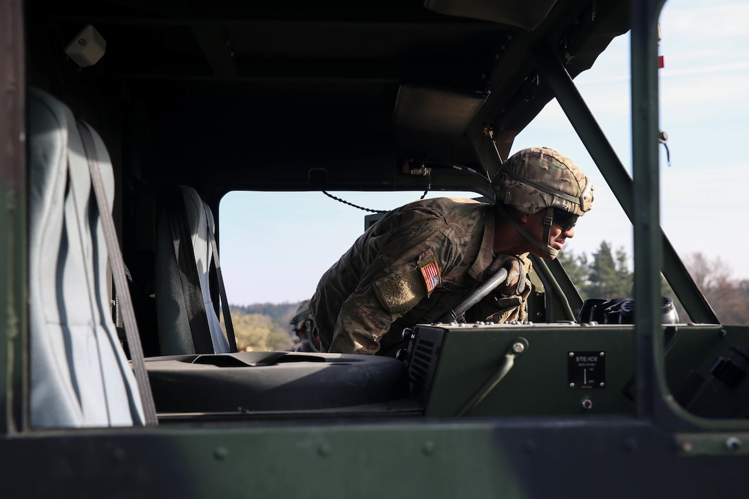 A soldier locks a vehicle's steering wheel while participating in vehicle recovery training during Exercise Saber Junction 16 at Hohenfels, Germany, April 5, 2016. Army photo by Pfc. Randy Wren
