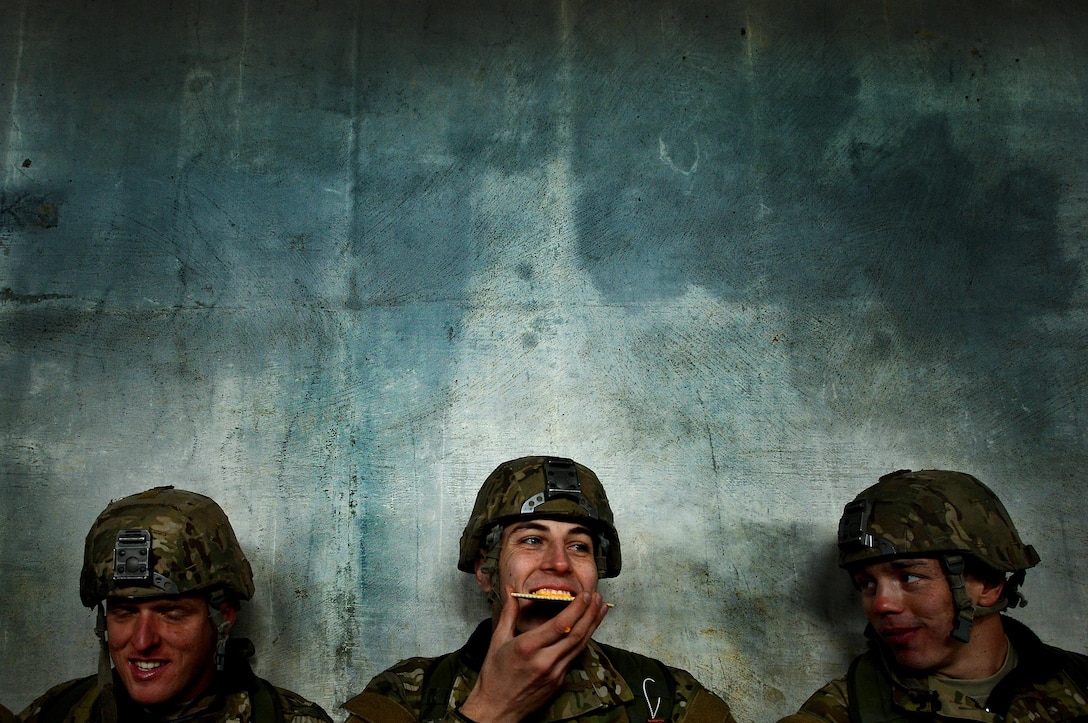 Combat Training: U.S. Air Force Combat Control trainees assigned to Operating Location C, 342nd Training Squadron, laugh with each other while sharing a meal ready to eat during a long day of training, Feb. 13, 2015. Working as a team and keeping morale high within the unit is vital to each Airman’s success as they push through training. At the 342nd TRS both CCT and Special Operations Weather Team trainees go through four months of grueling tactical and class room training. U.S. Air Force Photo by Staff Sgt. Kenny Holston