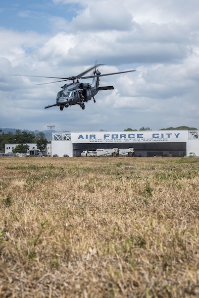 A U.S. Air Force HH-60G Pave Hawk helicopter, with the 33rd Rescue Squadron, Kadena Air Base, Japan, takes off from Clark Air Base, Philippines, April 19, 2016. The HH-60Gs flew in support of a newly stood up U.S. Pacific Command Air Contingent in the Indo-Asia-Pacific region. The Air Contingent will promote interoperability and provide greater and more transparent air and maritime situational awareness to ensure safety for military and civilian activities in international waters and airspace. This first deployment is conducting operations from Clark Air Base and consists of five A-10C Thunderbolt IIs, three HH-60G Pave Hawks and approximately 200 personnel deployed from multiple Pacific Air Forces units. (U.S. Air Force photo by Staff Sgt. Benjamin W. Stratton)