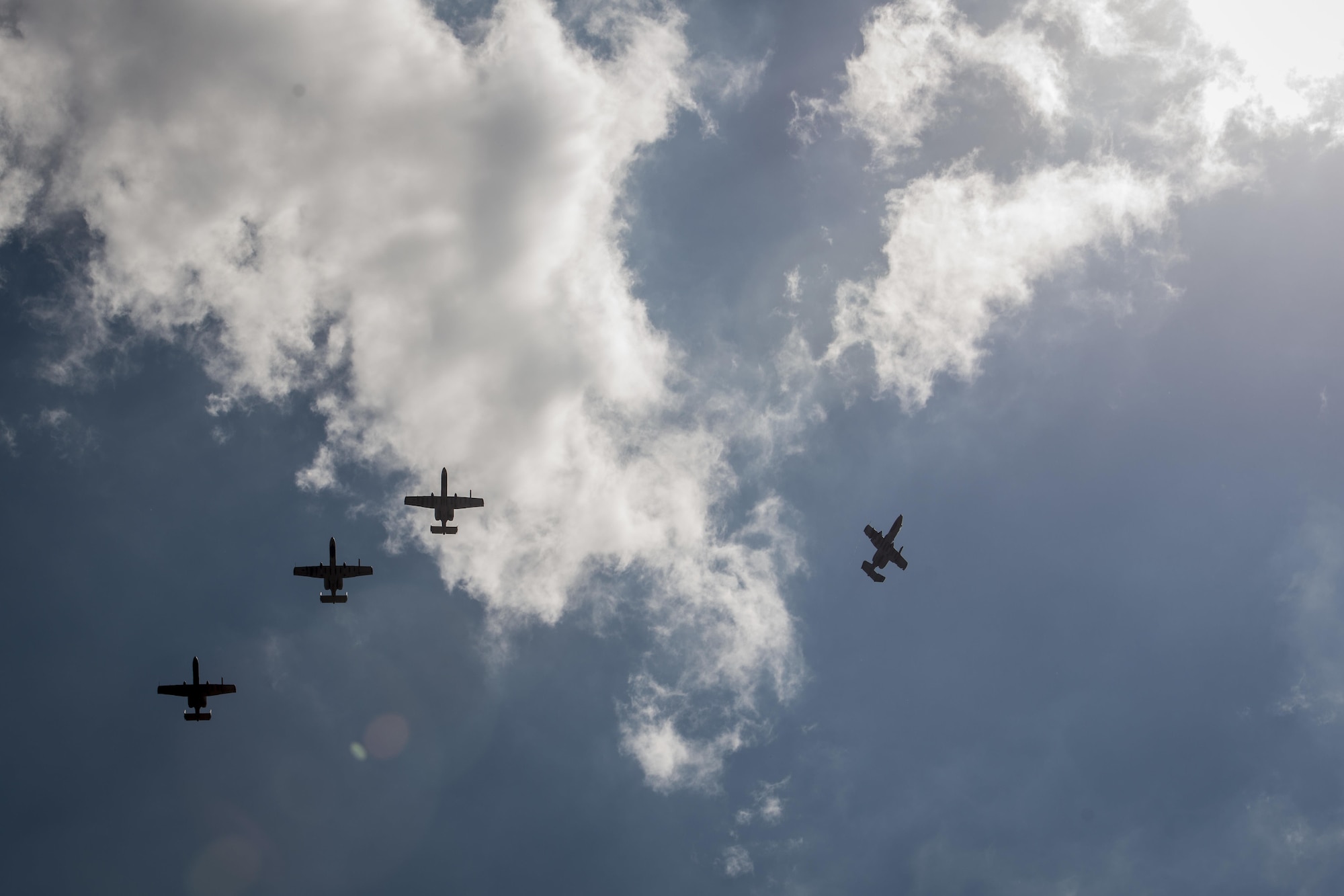 Four U.S. Air Force A-10C Thunderbolt IIs, with the 51st Fighter Wing, Osan Air Base, Republic of Korea, fly overhead after returning from their first mission out of Clark Air Base, Philippines, April 19, 2016. The A-10Cs are part of the newly stood up Air Contingent here conducting operations ranging from air and maritime domain awareness, personnel recovery, combating piracy, and assurance all nations have access to the regional air and maritime domains in accordance with international law. The A-10 missions enhance the U.S. military assets in the region upholding freedom of navigation and over flight. (U.S. Air Force photo by Staff Sgt. Benjamin W. Stratton)