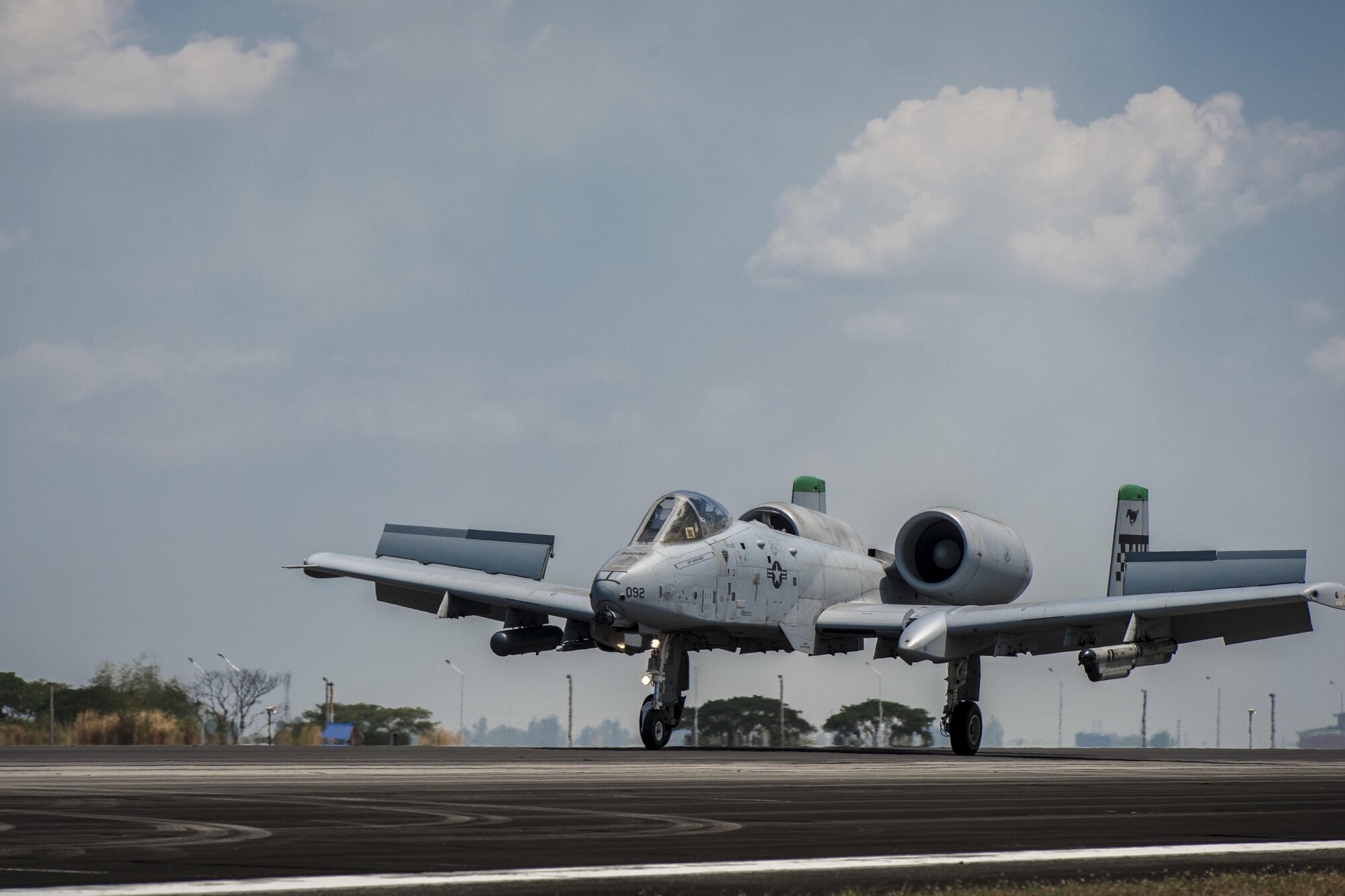 A U.S. Air Force A-10C Thunderbolt II, with the 51st Fighter Wing, Osan Air Base, Republic of Korea, touches down at Clark Air Base, Philippines, April 19, 2016, after returning from its first operational mission through international airspace providing air and maritime situational awareness. The A-10C’s mission enhances U.S. military assets in the region upholding freedom of navigation and over flight. The five A-10Cs are joined with three HH-60G Pave Hawks and approximately 200 personnel deployed from multiple Pacific Air Forces units to make up the first iteration of the U.S. Pacific Command Air Contingent at Clark Air Base, Philippines. (U.S. Air Force photo by Staff Sgt. Benjamin W. Stratton)