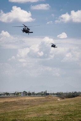 Two U.S. Air Force HH-60G Pave Hawk helicopters, with the 33rd Rescue Squadron, Kadena Air Base, Japan, return to Clark Air Base, Philippines, April 19, 2016, after flying their first operational mission in the region. These missions provide an opportunity to strengthen cooperation and interoperability with our Philippine counterparts and bolster regional security interests and goals. The HH-60Gs are joined by five A-10C Thunderbolt IIs, with the 51st Fighter Wing, Osan Air Base, Republic of Korea, and 200 Pacific Air Forces personnel as part of a newly stood up Air Contingent here conducting operations ranging from air and maritime domain awareness, personnel recovery, combating piracy, and assurance all nations have access to the regional air and maritime domains in accordance with international law. (U.S. Air Force photo by Staff Sgt. Benjamin W. Stratton)
