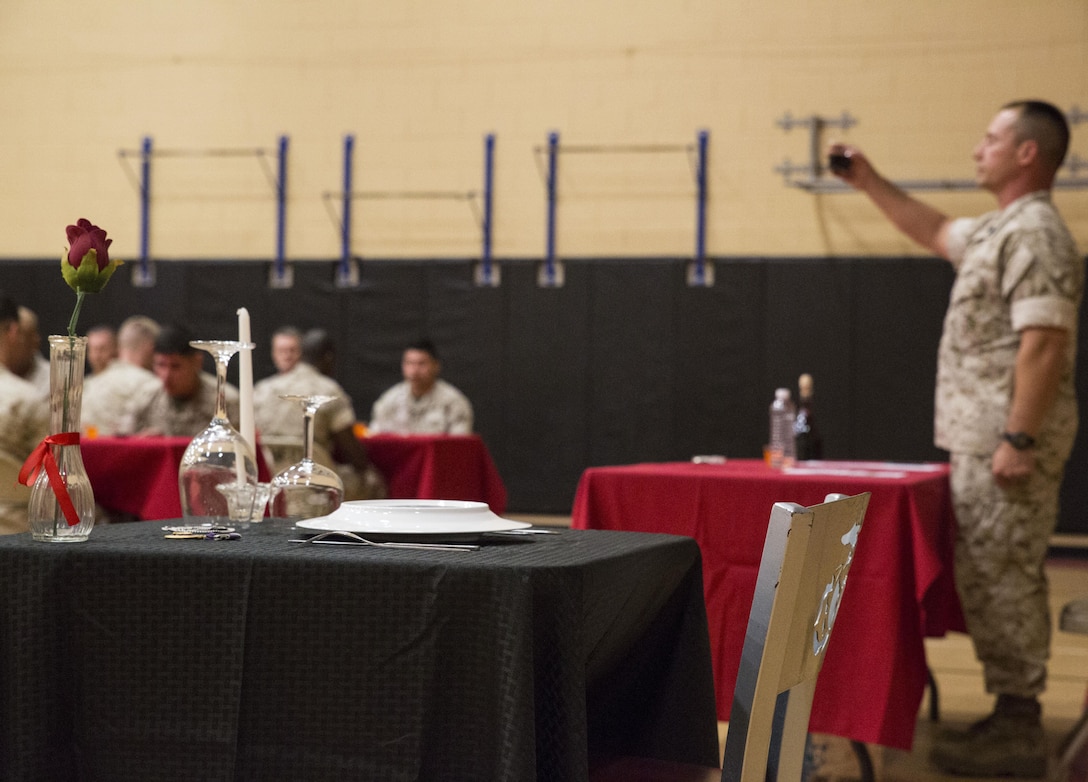 Marines with U.S. Marine Forces Command toast during the MARFORCOM Mess Night April 14 at the Camp Allen Fitness Center. The Mess allowed the Marines with the unit to build camaraderie as well as unit cohesion while also experiencing a Marine Corps tradition. Church is a systems non-commissioned officer with Headquarters and Service Battalion, MARFORCOM. (U.S. Marine Corps photo by Sgt. Anne K. Henry/RELEASED) 
