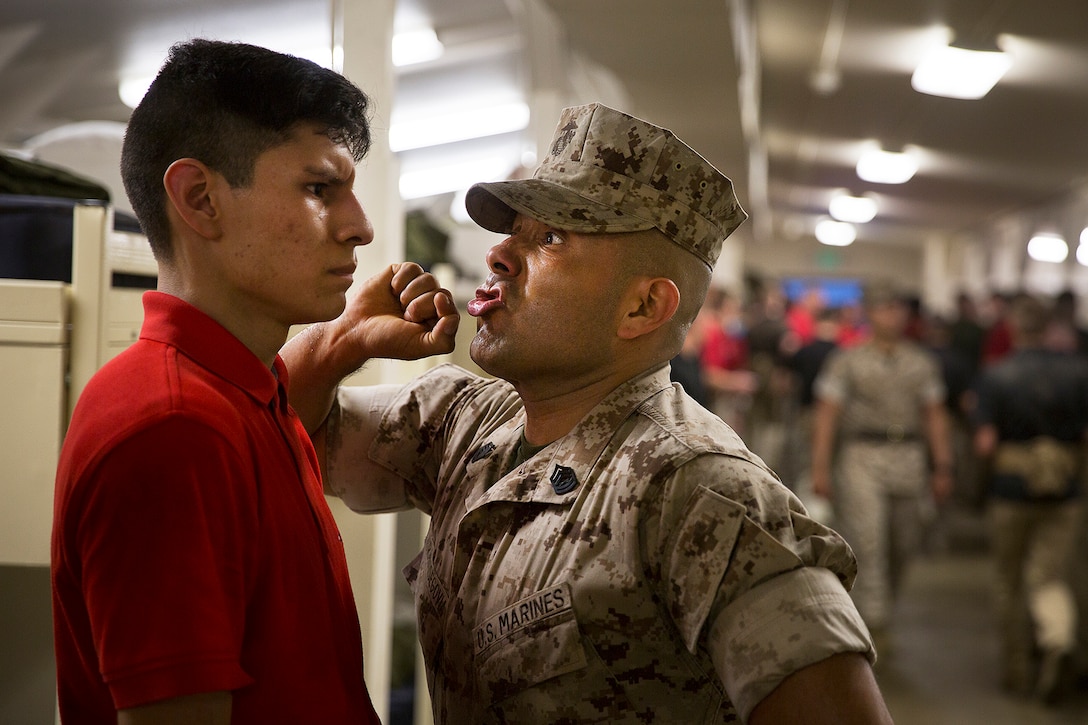Gunnery Sgt. Agustin Juradosegovia (right), formerly a drill instructor at Marine Corps Recruit Depot San Diego, instructs an officer candidate to respond loudly to his commands during an Officer Candidates School preparation event at the Yakima Training Center in Yakima, Wash., April 8, 2016. During the three-day event, Marine Corps sergeant instructors and officer recruiters worked together to physically and mentally prepare candidates for the rigors of OCS, which the candidates are projected to attend aboard Marine Corps Base Quantico, Virginia. Juradosegovia is from Oxnard, Calif. (U.S. Marine Corps photo by Sgt. Reece Lodder)