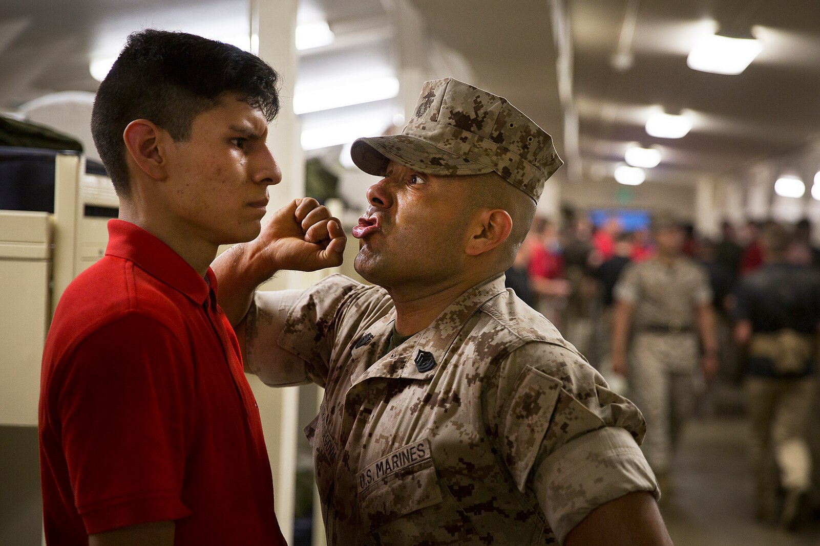 Gunnery Sgt. Agustin Juradosegovia (right), formerly a drill instructor at Marine Corps Recruit Depot San Diego, instructs an officer candidate to respond loudly to his commands during an Officer Candidates School preparation event at the Yakima Training Center in Yakima, Wash., April 8, 2016. During the three-day event, Marine Corps sergeant instructors and officer recruiters worked together to physically and mentally prepare candidates for the rigors of OCS, which the candidates are projected to attend aboard Marine Corps Base Quantico, Virginia. Juradosegovia is from Oxnard, Calif. (U.S. Marine Corps photo by Sgt. Reece Lodder)