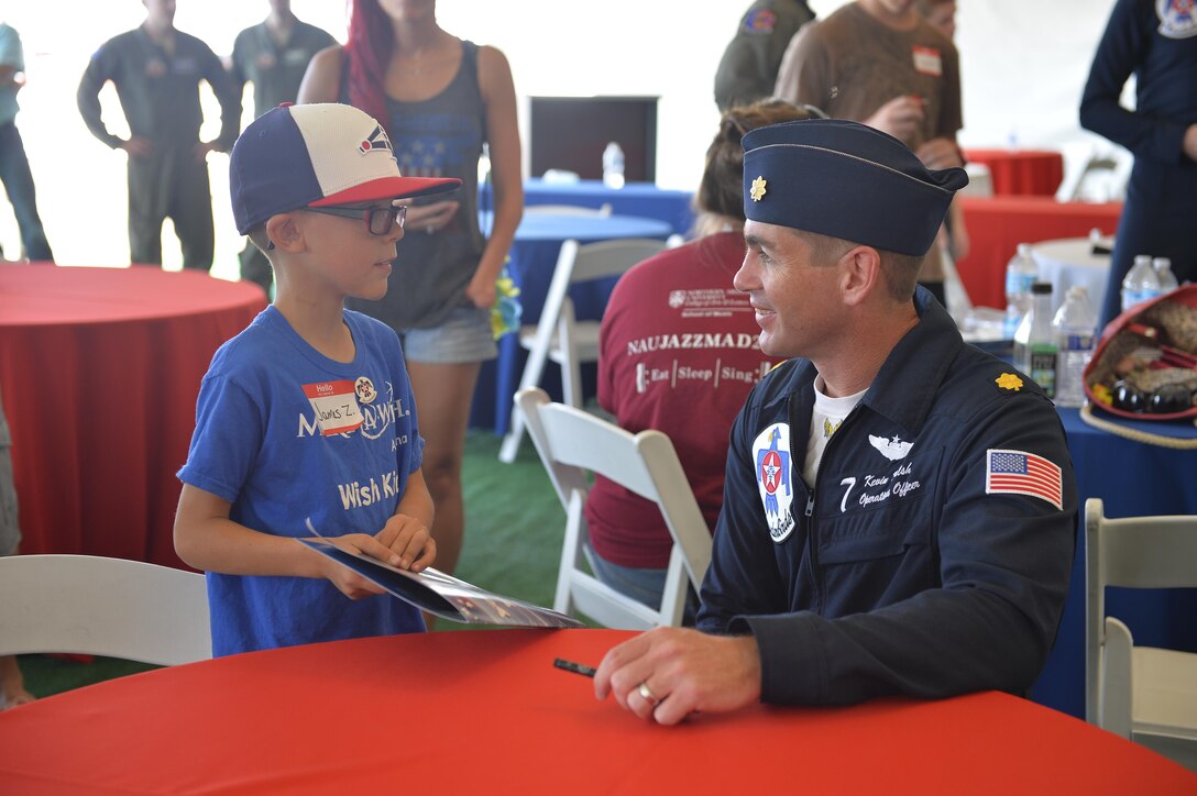 Air Force Maj. Kevin Walsh meets with a special guest at Luke Air Force Base, Ariz., April 1, 2016.  Walsh is a pilot, Thunderbird 7, assigned to the Air Force Thunderbirds. Air Force photo by Tech. Sgt. Christopher Boitz