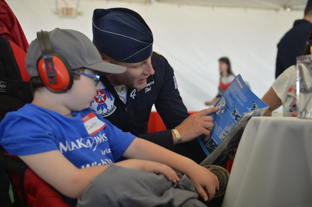 Air Force Maj. Nick Krajicek meets with a special guest at Luke Air Force Base, Ariz., April 1, 2016. Krajicek is a pilot, Thunderbird 4, assigned to the Air Force Thunderbirds. Air Force photo by Tech. Sgt. Christopher Boitz