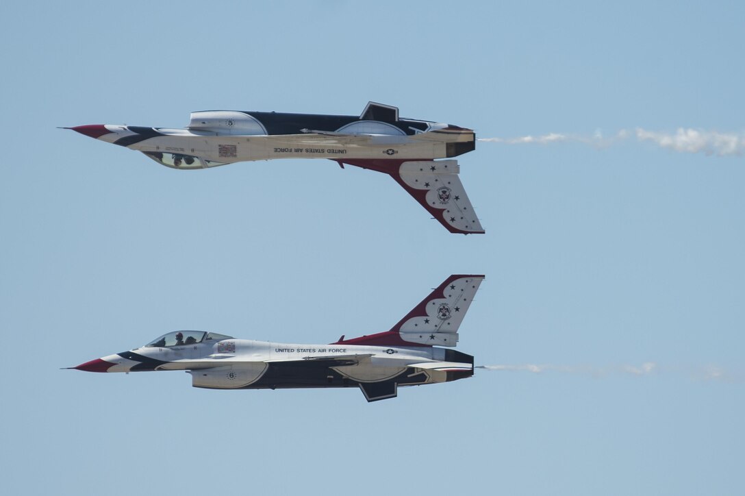 Capt. Nicholas Eberling, Thunderbird 5, above, and Maj. Alex Turner, Thunderbird 6, perform what is called the calypso pass during an airshow at Luke Air Force Base, Ariz., April 2, 2016. Air Force Photo by Tech. Sgt. Christopher Boitz