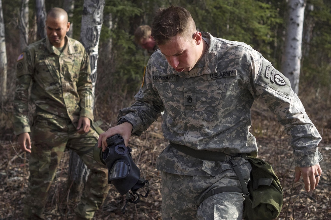 Army Staff Sgt. Derek Leonhardt reacts to tear gas exposure during chemical, biological, radiological and nuclear defense training at Joint Base Elmendorf-Richardson, Alaska, April 13, 2016. Leonhardt is assigned to the 25th Infantry Division, 40th Cavalry Regiment, 4th Brigade Combat Team (Airborne), Alaska. Air Force photo by Justin Connaher