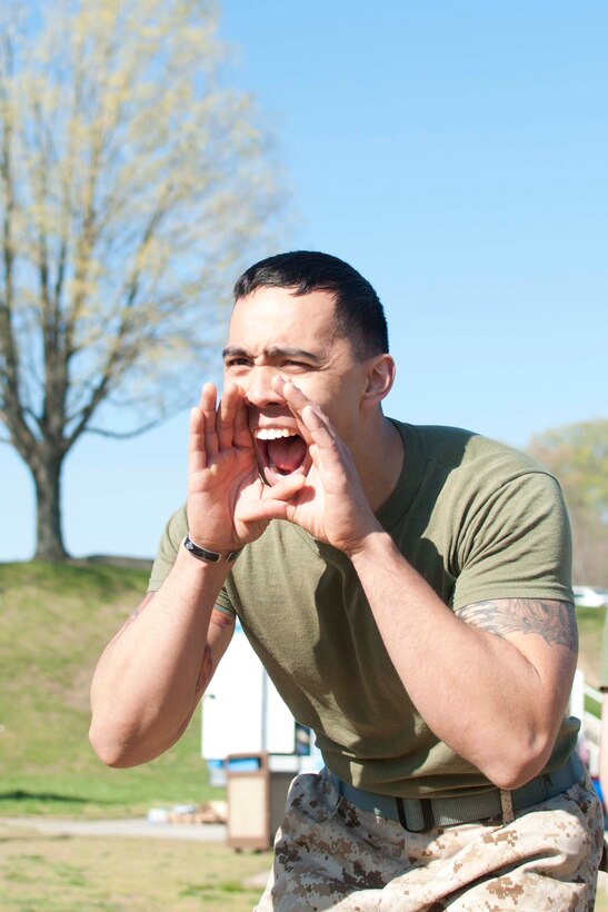 Team captain Sgt. Michael Matsui, Marine Corps Intelligence Activity intelligence specialist, motivates Marines.