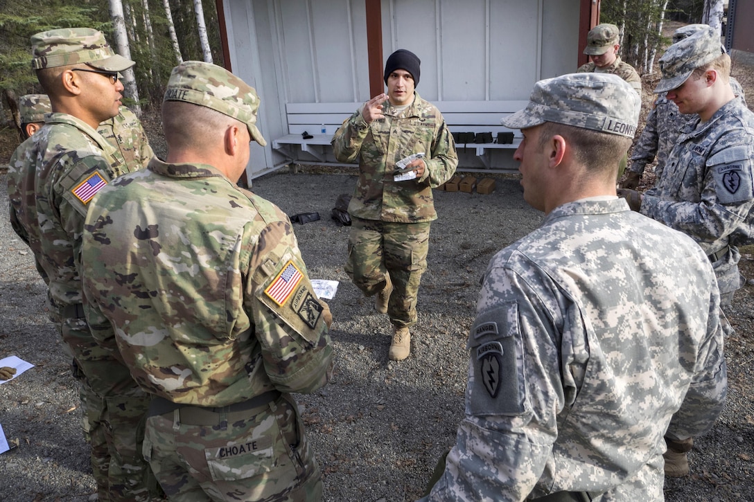 Army Sgt. Jorge Soriano, center, conducts chemical, biological, radiological and nuclear defense training at Joint Base Elmendorf-Richardson, Alaska, April 13, 2016. Air Force photo by Justin Connaher 