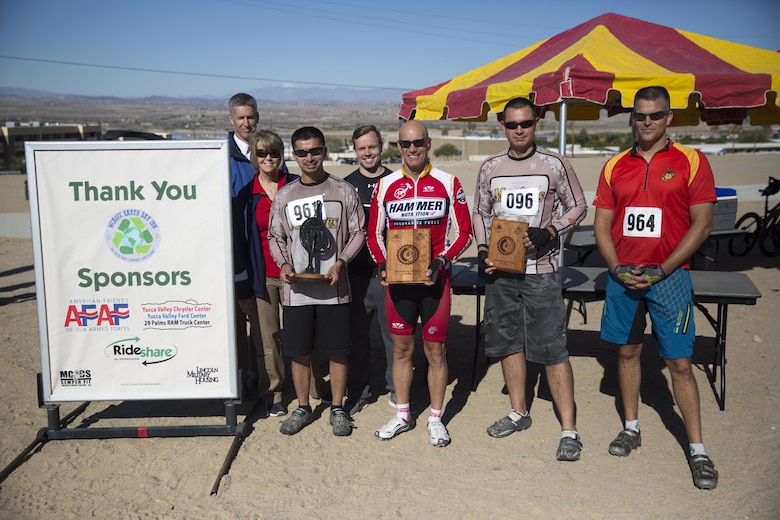 Winners of the Annual Earth Day Mountain Bike Ride held near Range 100 aboard the Combat Center proudly display their awards April 13, 2016. The eight-mile bike ride began and ended at Range 100. (Official Marine Corps photo by Cpl. Julio McGraw/Released)