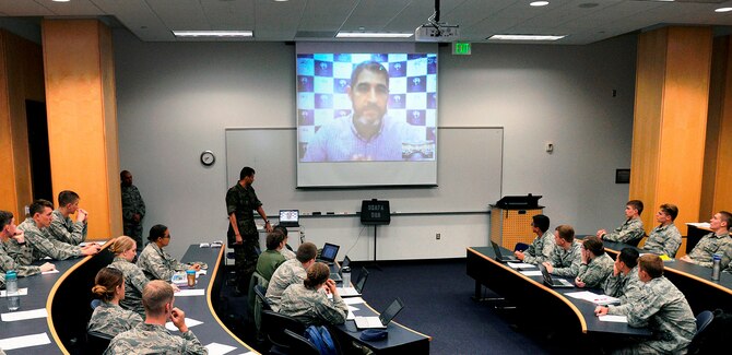 Marcelo Pedroso, the president of the Brazilian Olympic Public Authority, chats with Portuguese-language students at the U.S. Air Force Academy via video teleconference April 7. Pedroso spoke from his office in Rio de Janeiro and answered cadets' questions on how Rio will handle the massive undertaking of hosting the 2016 Olympic Games. (U.S. Air Force photo/Mike Kaplan)
