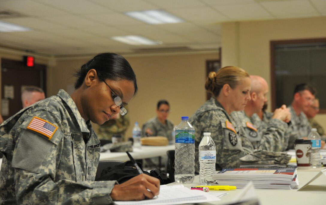 U.S. Army Reserve Capt. Joan Jordan, Trial Counsel, 335th Signal Command (Theater), East Point, Georgia, takes notes April 19, 2016, at Camp Atterbury, Ind., during Cyber Shield 2016 in the Law of Data Security and Investigations class hosted by the SANS Institute. Cyber Shield 2016 is an Army National Guard cyber training exercise designed to develop and train cyber capable forces to include Army Reserve Soldiers, Marines, Air National Guardsmen and other federal agencies.
