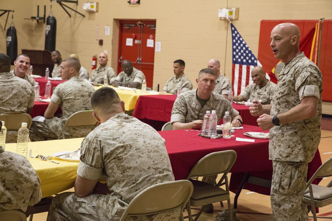 Marines with U.S. Marine Corps Forces Command begin their Mess Night at the Camp Allen Fitness Center April 14. Throughout the night, the Marines participated in traditions dating back decades including toasting and fining while also reinforcing their cohesion and camaraderie. (U.S. Marine Corps photo by Sgt. Anne K. Henry/RELEASED)  