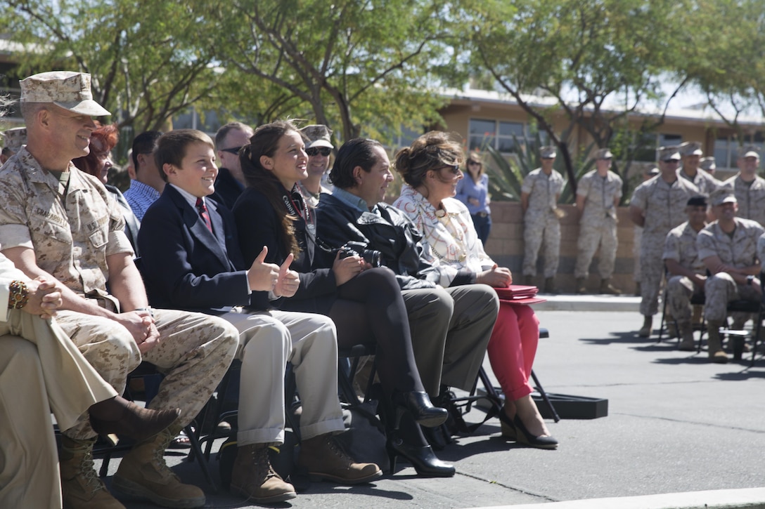 Family members of Col. Andrew R. Kennedy, former director of Tactical Training and Exercise Control Group, listen as he speaks during his retirement ceremony at Lance Cpl. Torrey L. Gray Field April 15, 2016. (Official Marine Corps photo by Cpl. Medina Ayala-Lo/Released)