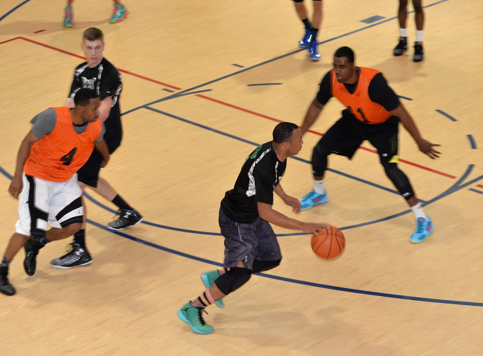 Exzavior Webb, 2nd Communcations Squadron shooting guard, looks for the open man, during a championship basketball game at Barksdale Air Force Base, La., April 14, 2016.  The 2nd CS team finished the regular season with a 9-3 record and knocked off an undefeated team and championship favorite on its way to the season’s final game. (U.S. Air Force photo/Airman 1st Class Curt Beach) 