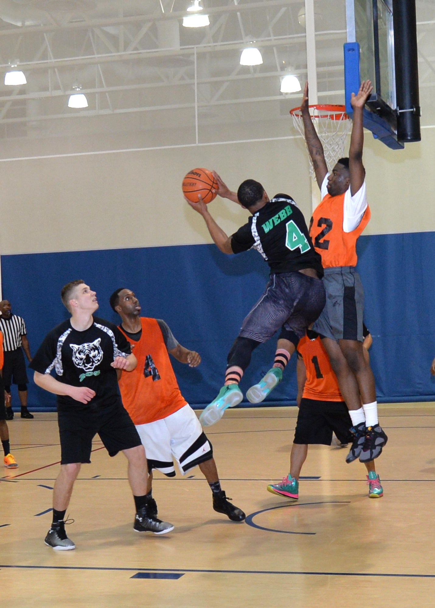 Exzavior Webb, 2nd Communcations Squadron shooting guard, attacks the basket, during a championship basketball game at Barksdale Air Force Base, La., April 14, 2016. Webb led his team with 18 points in the first game of the night’s series and 25 in the second. (U.S. Air Force photo/Airman 1st Class Curt Beach) 