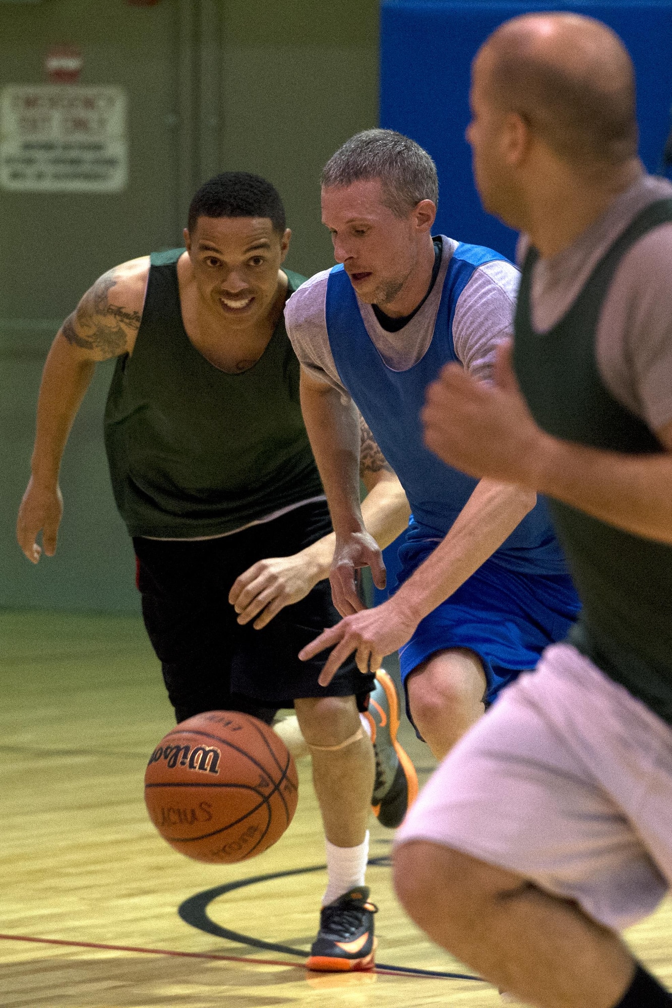 Dustin Pervine, 434th Logistics Readiness Squadron team, moves in to steal the ball from Cory Walters, 434th Security Forces Squadron ‘A’ team, during the final game of Grissom’s annual basketball tournament April 9, 2016 at Grissom Air Reserve Base, Ind. LRS shackled the Cops 36-32 to win the tournament. (U.S. Air Force photo/Senior Airman Dakota Bergl)