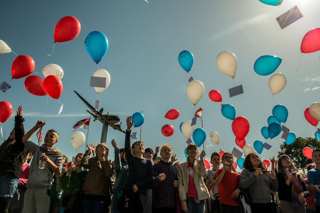News: French children release balloons to celebrate the service of the U.S. troops who helped liberate Normandy during World War II in Normandy, France, June 4, 2015. More than 380 service members from Europe and affiliated D-Day historical units are participating in the 71st anniversary as part of Joint Task Force D-Day 71. U.S. Air Force photo by Senior Airman Nicole Sikorski