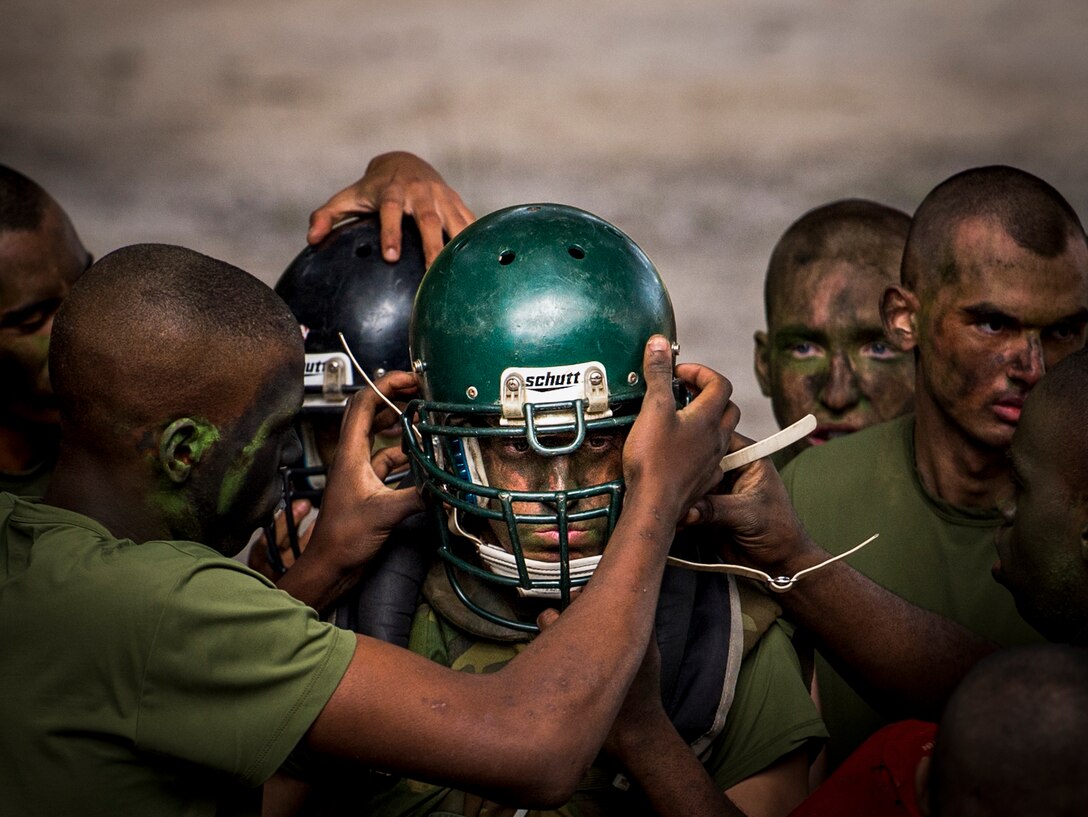 Sports Photography: Marine Corps recruits help their teammates put on gear before pugil stick fighting training at Marine Corps Recruit Depot in Parris Island, S.C., Dec. 3, 2015. The training teaches recruits the importance of knowing how to fight as well as how to work together in order to succeed. U.S. Marine Corps photo by Staff Sgt. Marianique Santos