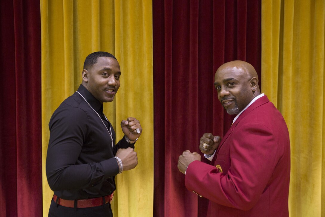 Sgt. Teddy Randolph Jr. (left) and his father retired Cpl. Teddy Randolph Sr. pose for a photograph during an induction ceremony held aboard Marine Corps Base Camp Lejeune, N.C., April 16, 2016. After medically retiring from the Corps 24 years ago, Randolph Sr. alongside approximately 50 fellow boxers from various periods of the team’s existence, were inducted into the All-Marine Boxing Hall of Fame. Randolph Jr. is an administration clerk with Marine Corps Individual Reserve Support Activity in New Orleans, La. Randolph Sr. is a member of the All-Marine Boxing Team Hall of Fame. 