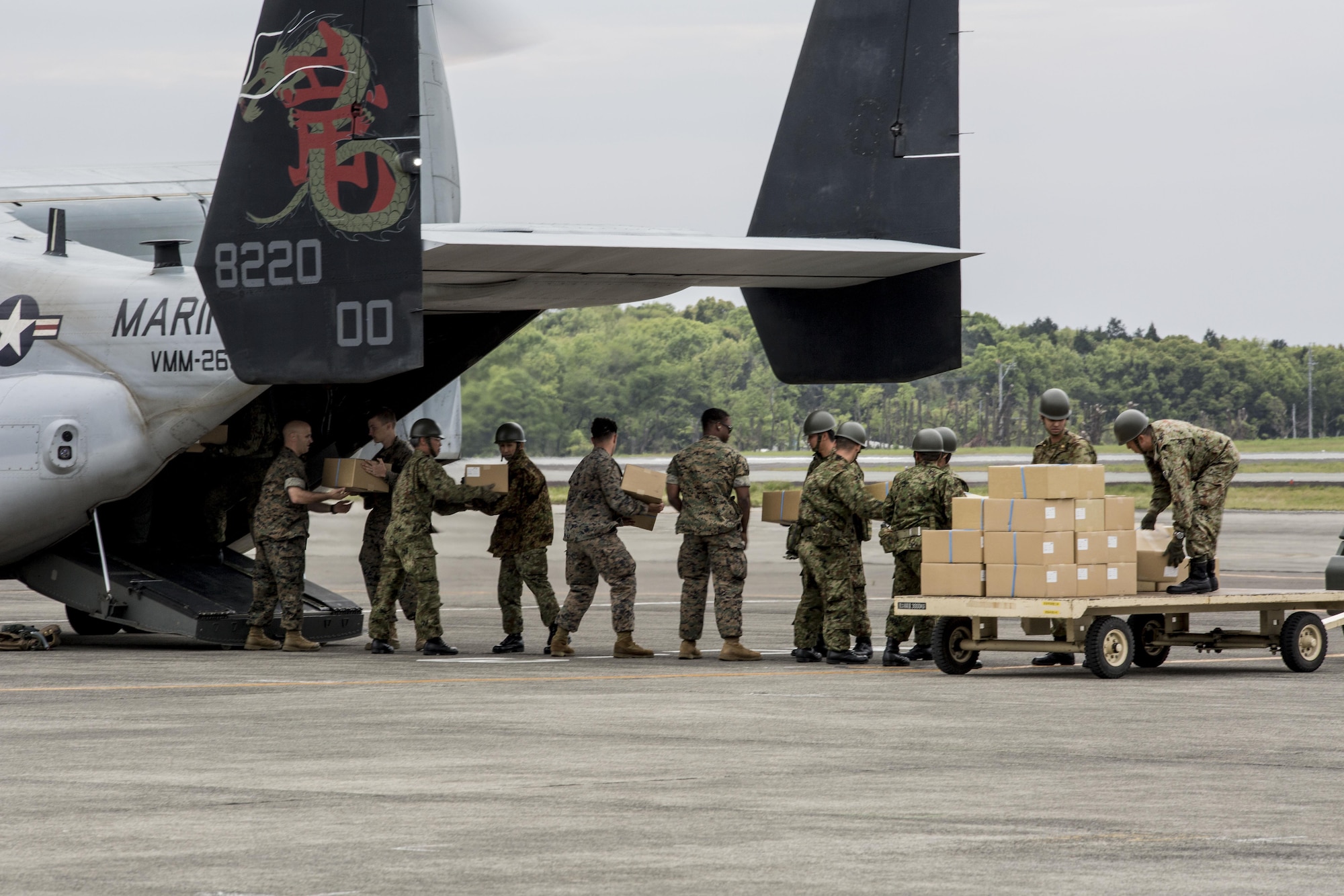 U.S. Marines and Japanese soldiers load boxes of humanitarian aid into an MV-22 Osprey aircraft at Japanese Camp Takayubaru, Japan, April 18, 2016, to support earthquake relief efforts near Kumamoto. (Marine Corps photo/Cpl. Nathan Wicks)
