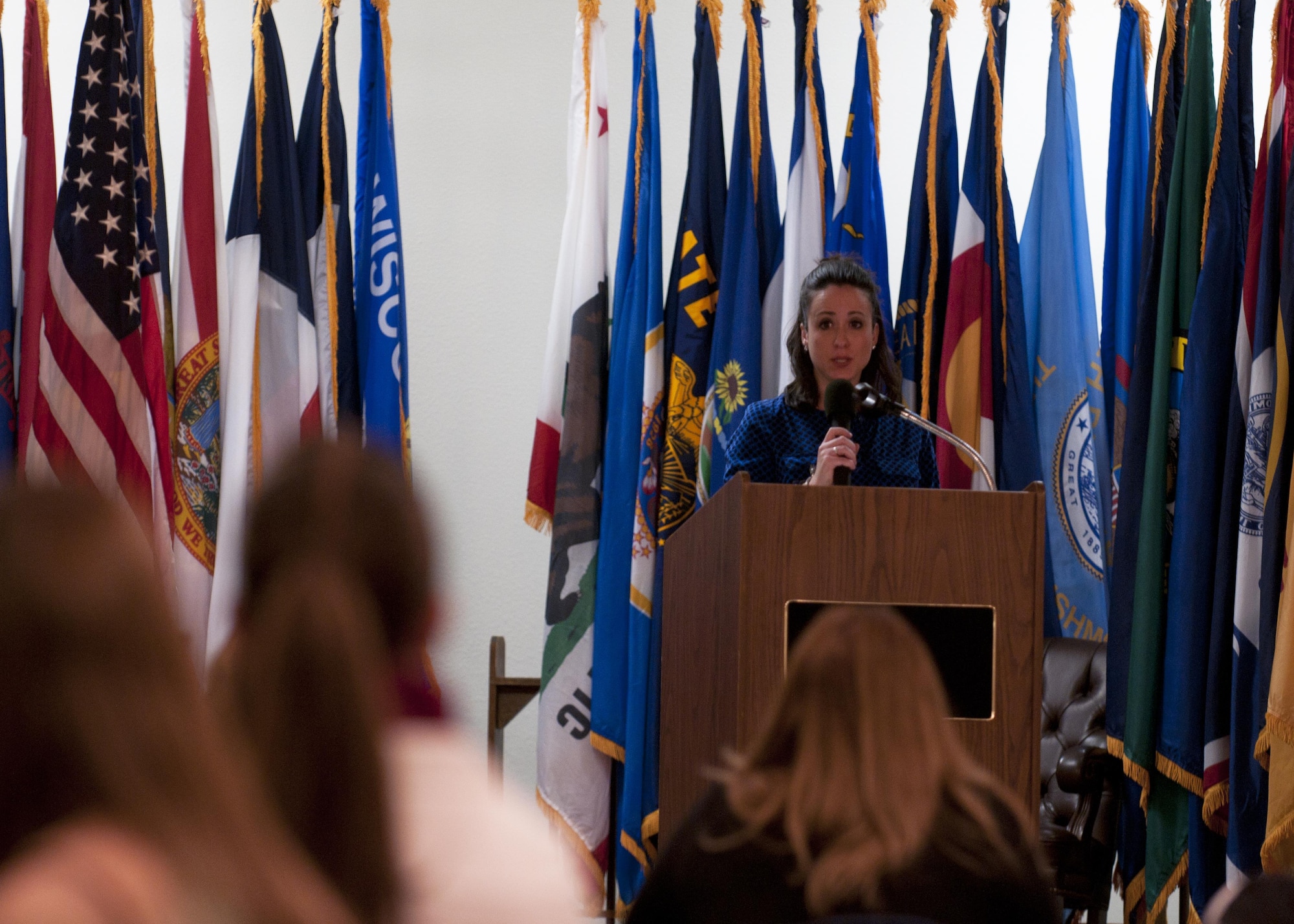 Danielle Alvarez, Warren Spouses’ Club member, addresses the audience at the club’s annual scholarship award ceremony, April 19, 2016. The scholarships provided by the club are funded completely by the annual basket auction held by the club. (U.S. Air Force photo by Airmen 1st Class Malcolm Mayfield)