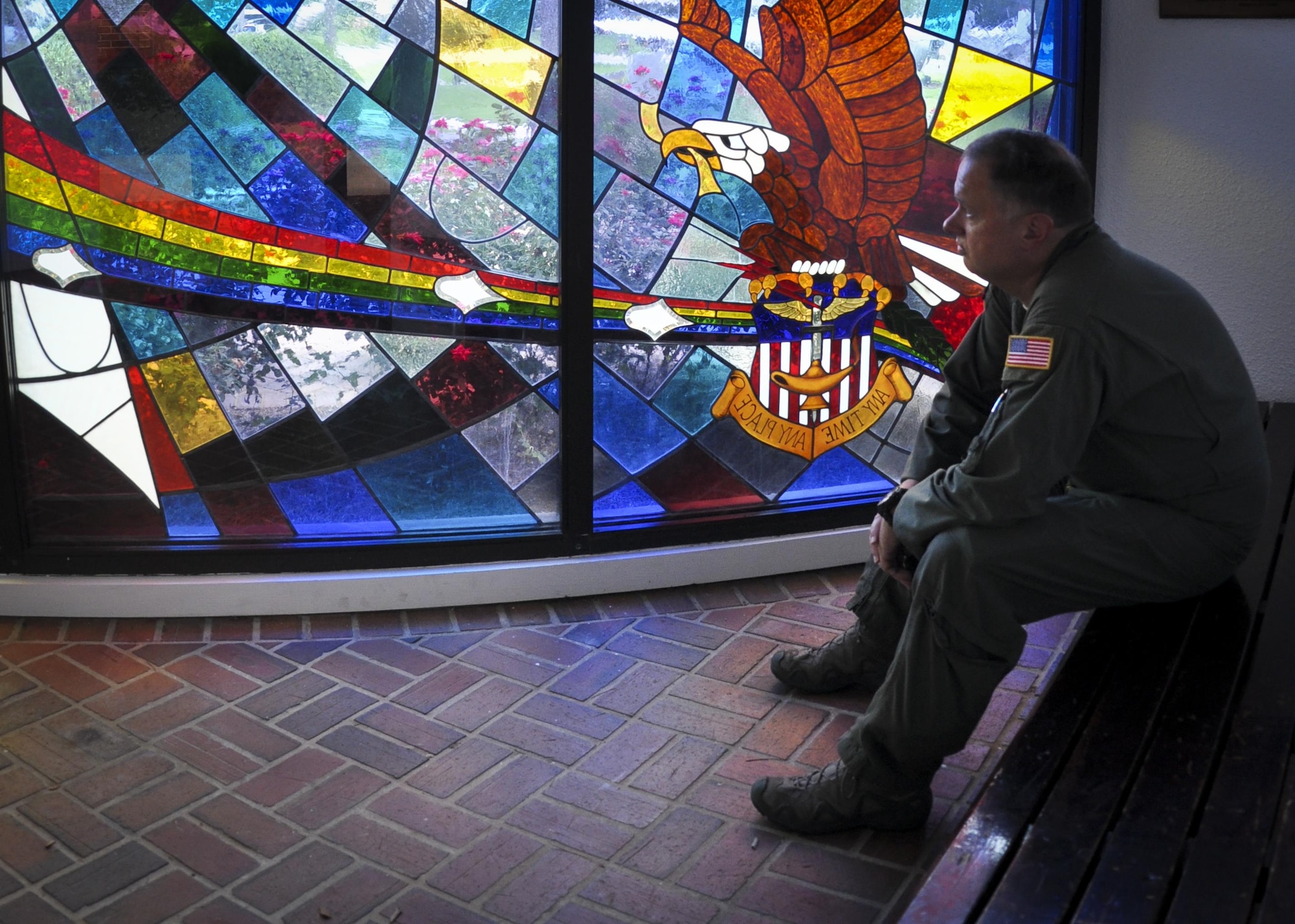 Chief Master Sgt. Raymond Beyers, 2nd Special Operations Squadron, pauses to reflect on his late father’s memory as he gazes toward the Stained Glass Memorial Window at the Hurlburt Field, Florida, chapel recently.  The window was dedicated in April 1982 in honor of the eight Airmen and Marines who died in Iran during Operation Eagle Claw in 1980. (U.S. Air Force photo/Dan Neely)  