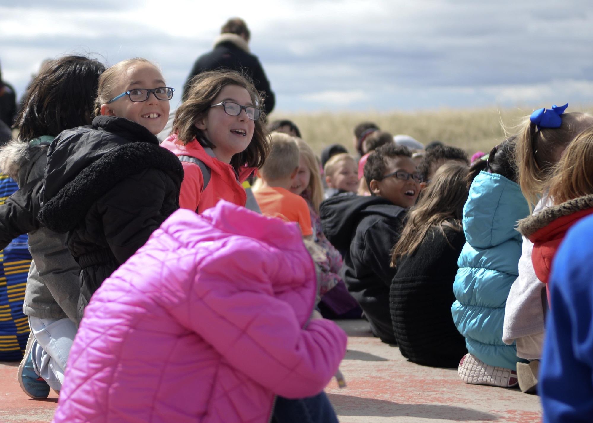 Children from Freedom Elementary School in Cheyenne, Wyo., watch as a helicopter lands April 20, 2016. The event was held in support of the Month of the Military Child month-long campaign. (U.S. Air Force photo by Airman 1st Class Malcolm Mayfield)