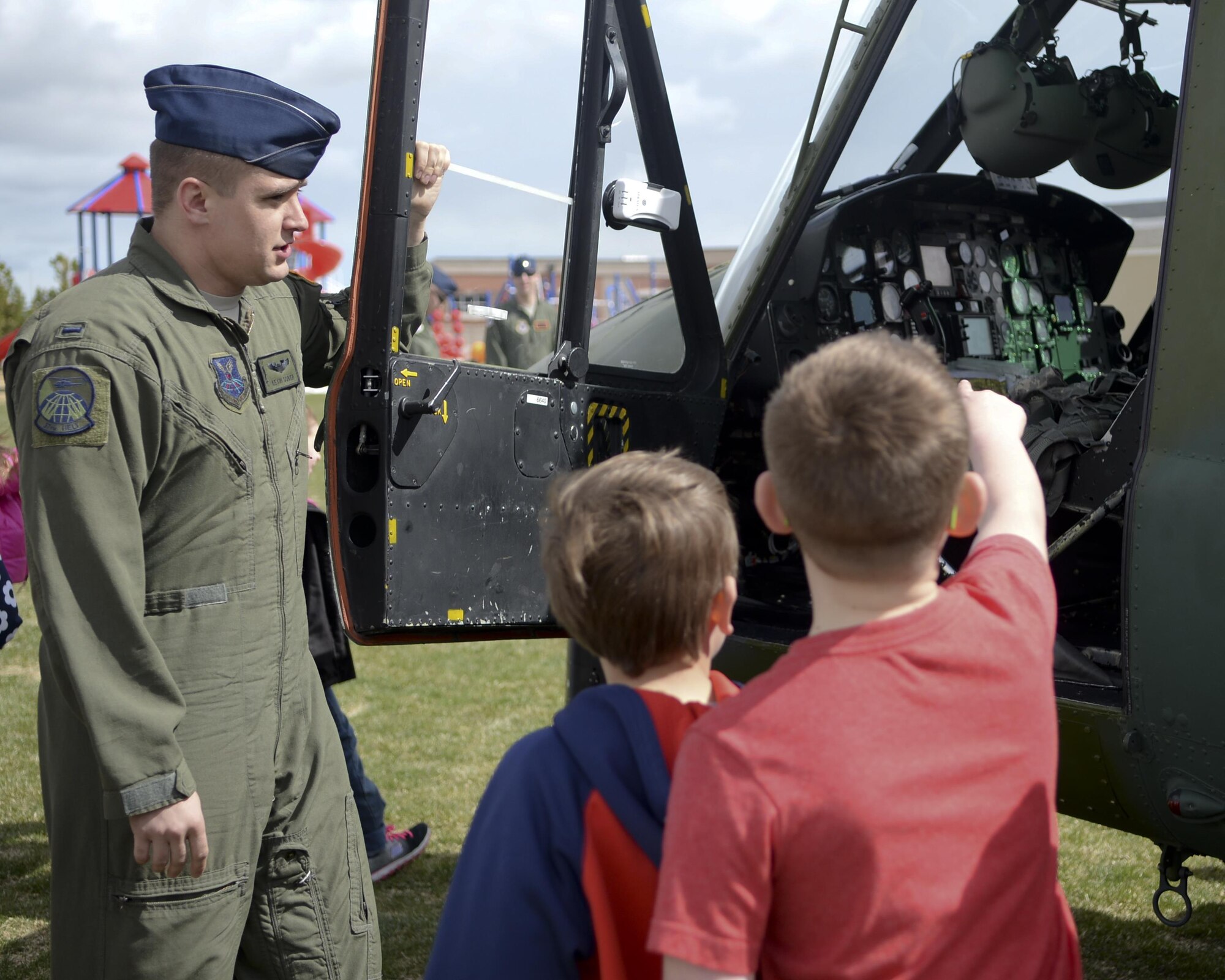 First Lieutenant Kevin Sober, 37th Helicopter Squadron pilot, talks with children at Freedom Elementary School about the UH-1N Bell Helicopter April 20, 2016. The majority of children attending Freedom Elementary have parents who are stationed at F.E. Warren Air Force Base, Wyo.  (U.S. Air Force photo by Airman 1st Class Malcolm Mayfield)