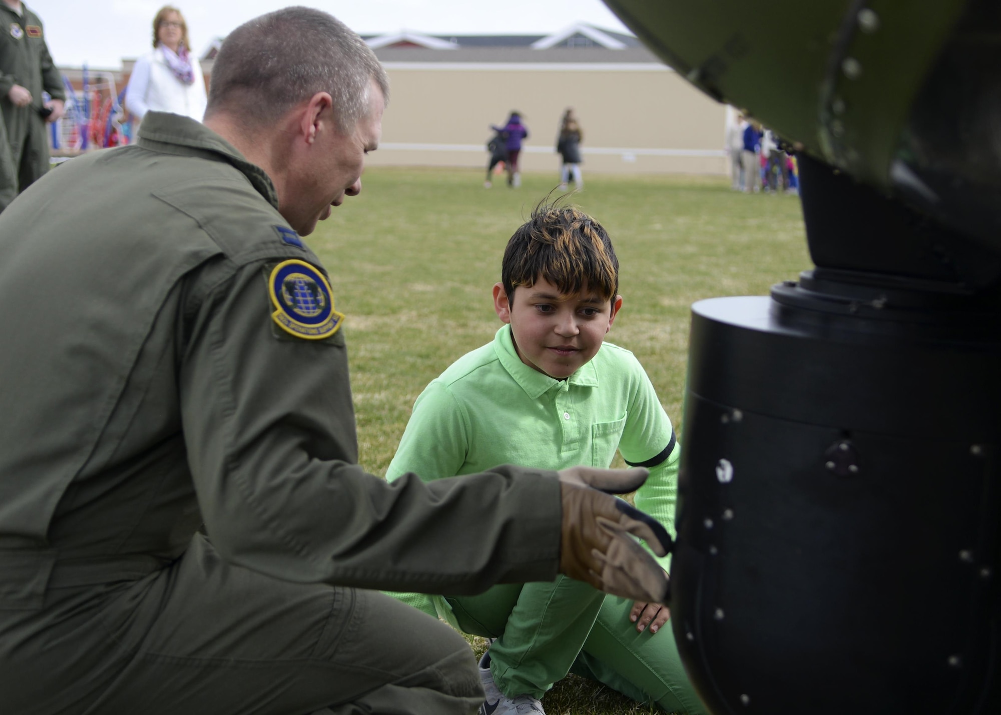 Izaiah Mackeyfill, Freedom Elementary School student, listens to a pilot from the 37th Helicopter Squadron, April 20, 2016 in Cheyenne, Wyo. Military children make up a large percentage of school’s student body.