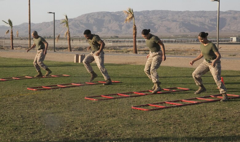 Sgt. Maj. Avery Crespin, Headquarters Battalion Sergeant Major, exercises with Headquarters Battalion Marines during a High Intensity Tactical Training event held by Crespin and the HITT staff at Del Valle Field April, 15, 2016. (Official Marine Corps photo by Cpl. Thomas Mudd/Released)