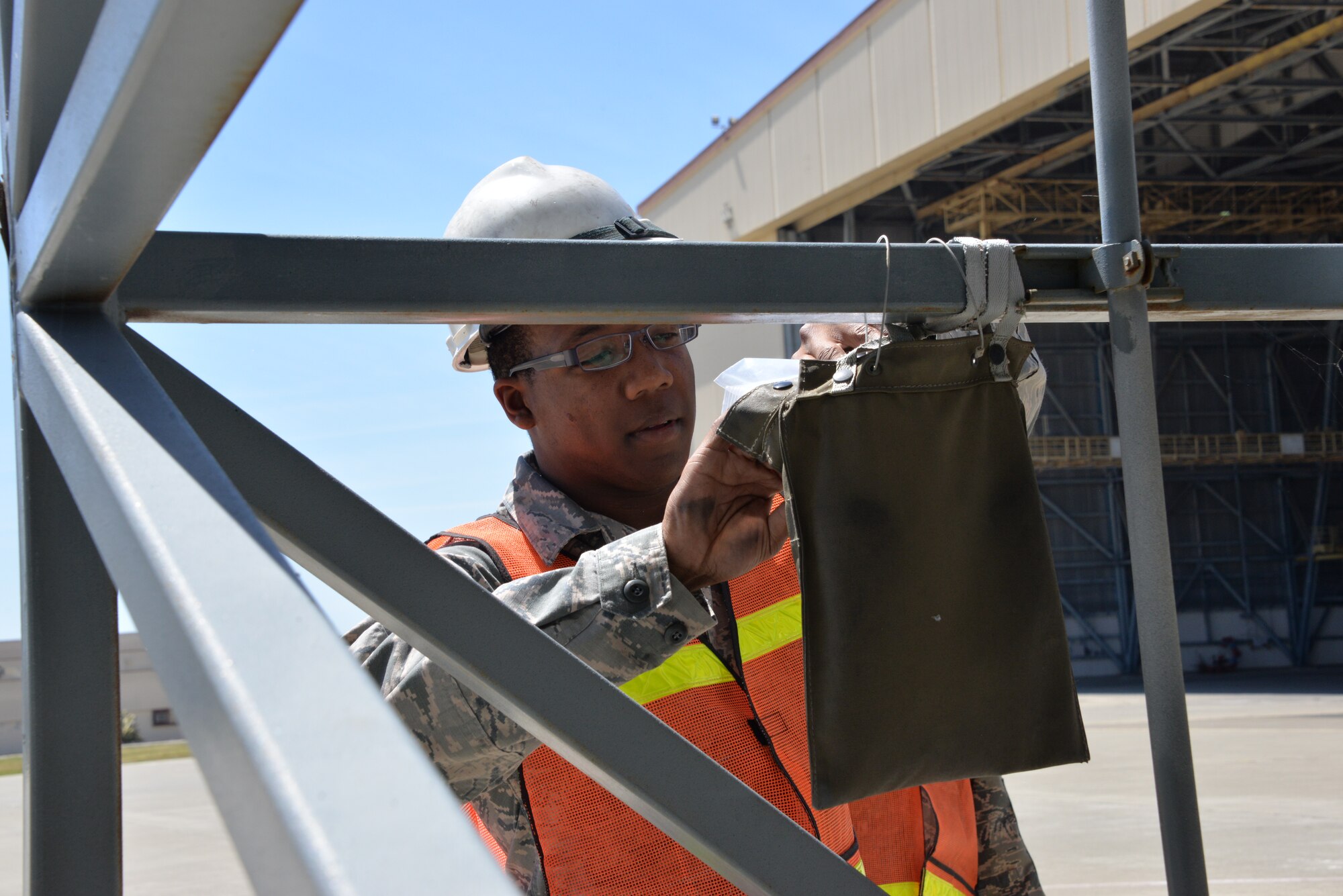 Airman 1st Class Eric Lambert, 60th MXS section team member, performs an inspection April 18 at Travis Air Force Base, California. The Phoenix Pride Program gathers a team of three Airmen from different sections of MXS and allows them to perform 250 inspections per week using their individual expertise. (U.S. Air Force photo by Senior Airman Amber Carter)