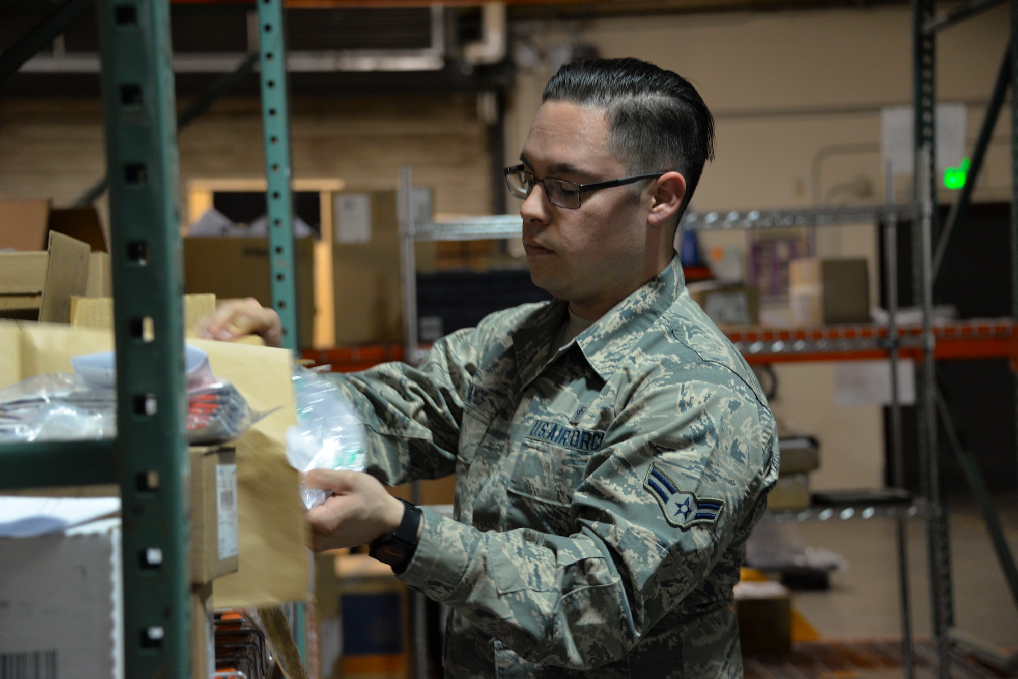 Airman 1st Class Joey Ramos, 60th MDSS medical logistics technician, prepares to deliver supplies to the anesthesia department at David Grant USAF Medical Center. The medical logistics warehouse is responsible for more than $182,000 worth of material. (U.S. Air Force photo by Senior Airman Amber Carter)