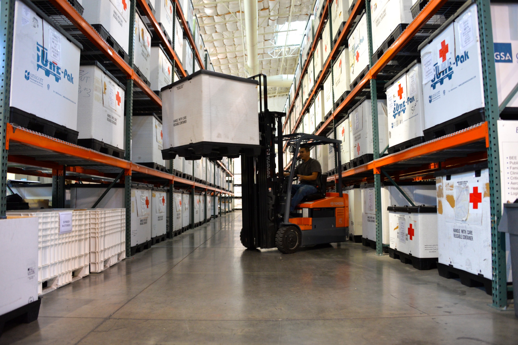 Michael Romo, 60th MDSS medical logistics technician, stocks tri-wall containers April 20 at Travis Air Force Base, California. Each box contains an array of war reserve material for readiness and deployment purposes. The consolidated support distribution center warehouse is one of three in the United States and houses more than $50 million worth of material. (U.S. Air Force photo by Senior Airman Amber Carter)